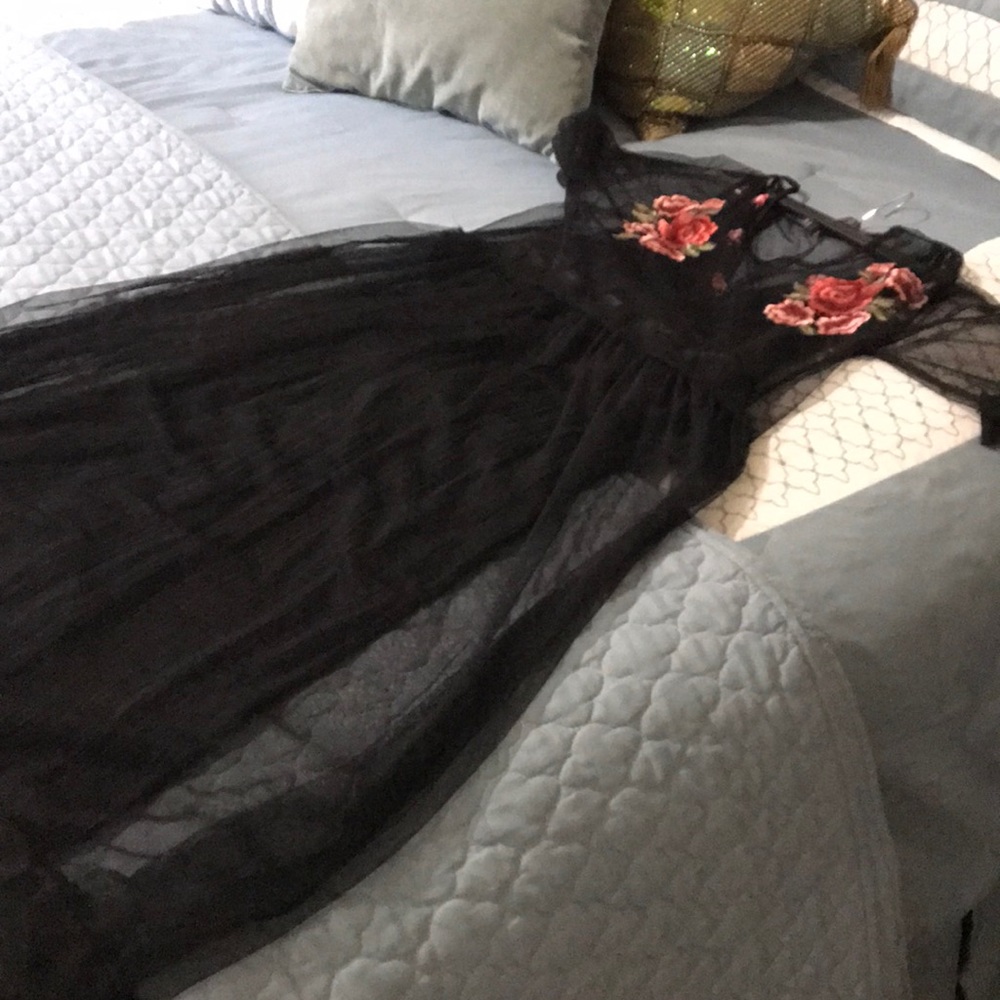 Evening pants suit with tulle overlay.